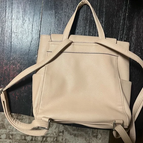 Nanette Lepore pebbled vegan leather backpack in a light pink or beige color. - Picture 2 of 9